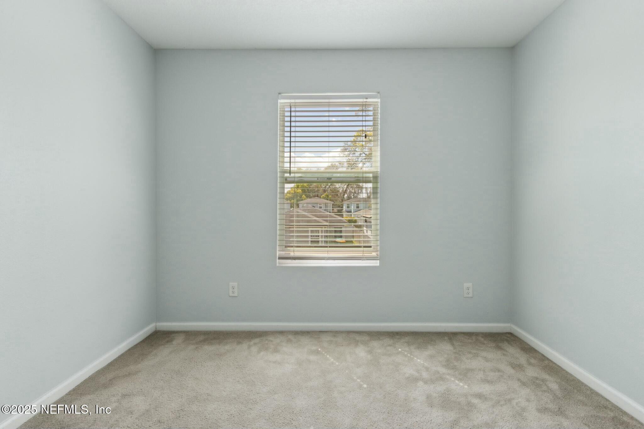8414 Thor Street Jacksonville, FL 32216 - Photo 28 of 40 an empty room with a window