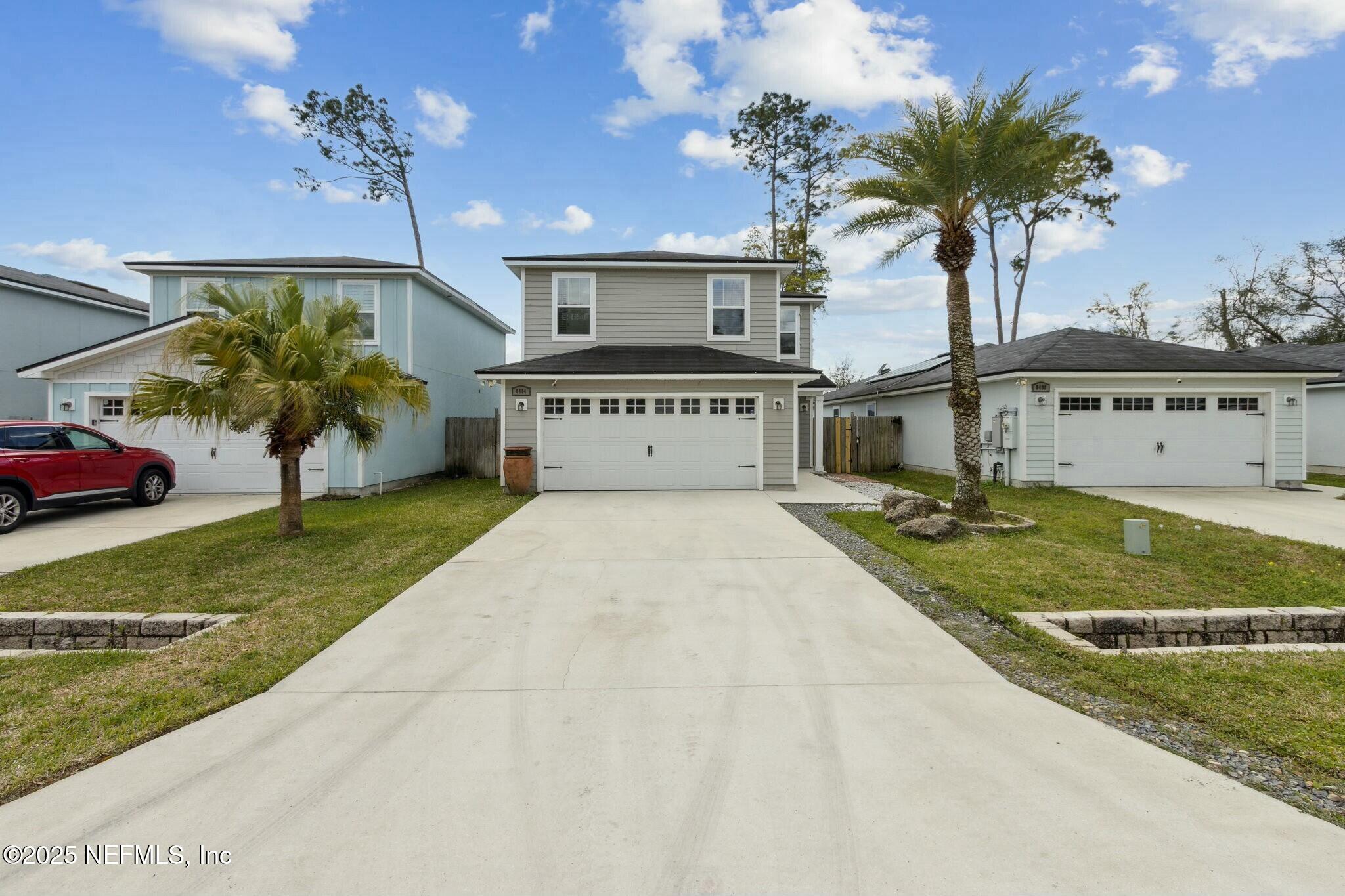8414 Thor Street Jacksonville, FL 32216 - Photo 3 of 40 a front view of a house with garden