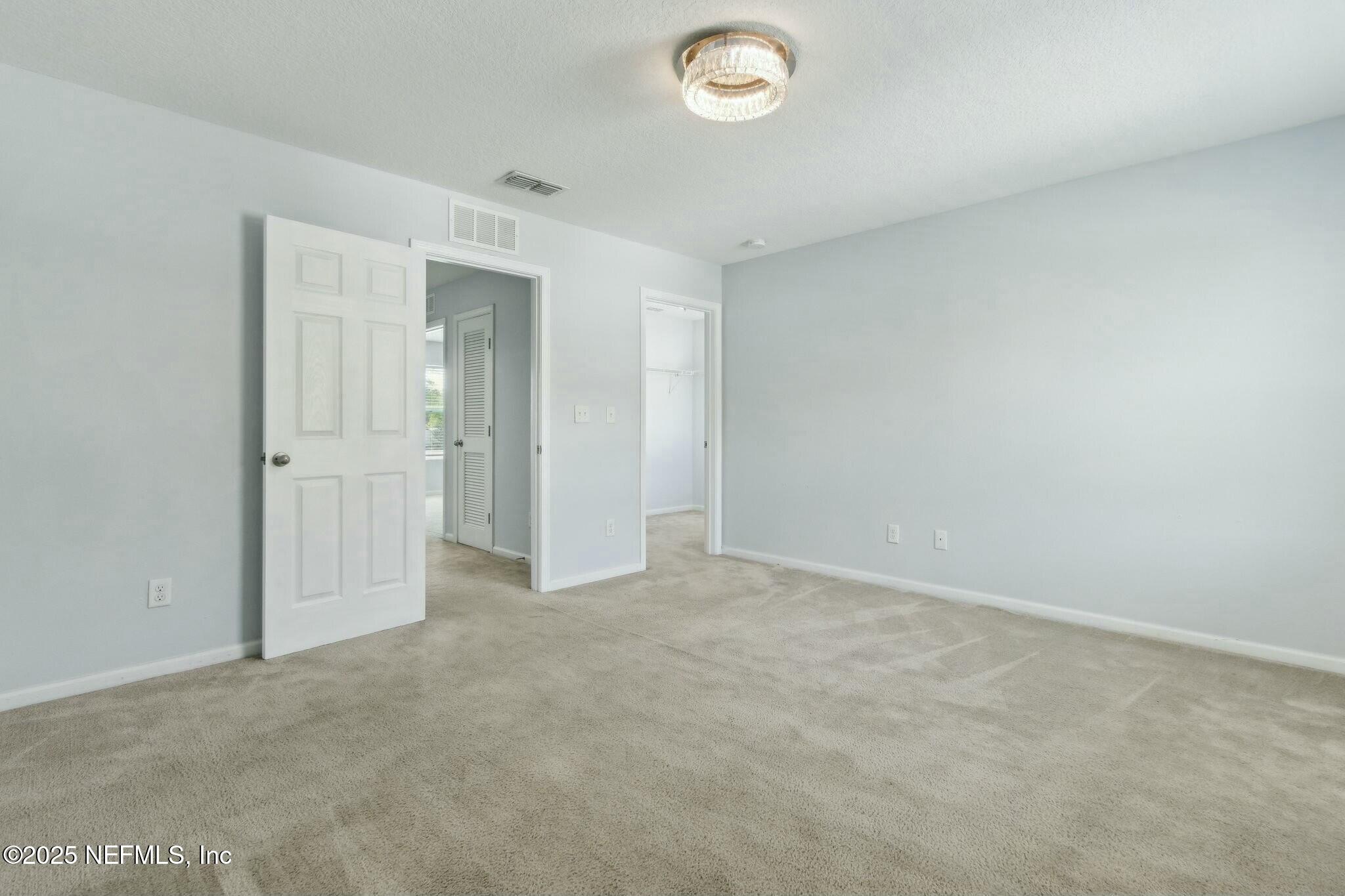 8414 Thor Street Jacksonville, FL 32216 - Photo 31 of 40 an empty room with closet area