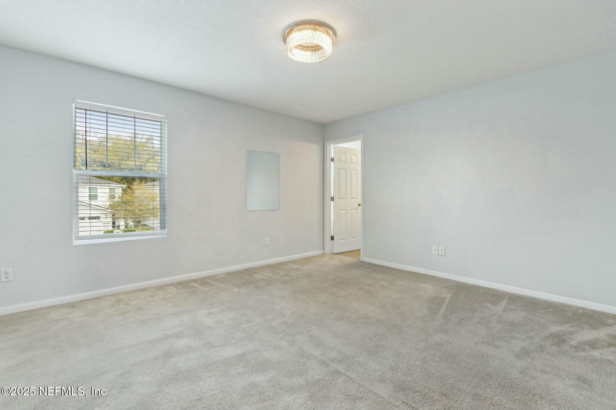 8414 Thor Street Jacksonville, FL 32216 - Photo 33 of 40 an empty room with a window