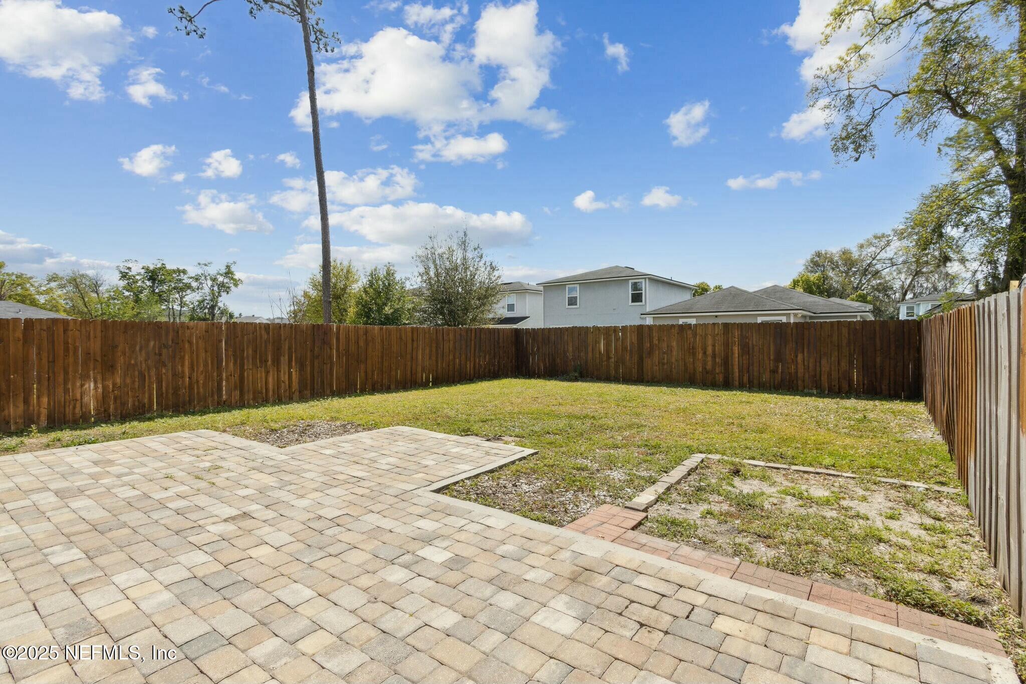 8414 Thor Street Jacksonville, FL 32216 - Photo 39 of 40 a backyard of a house