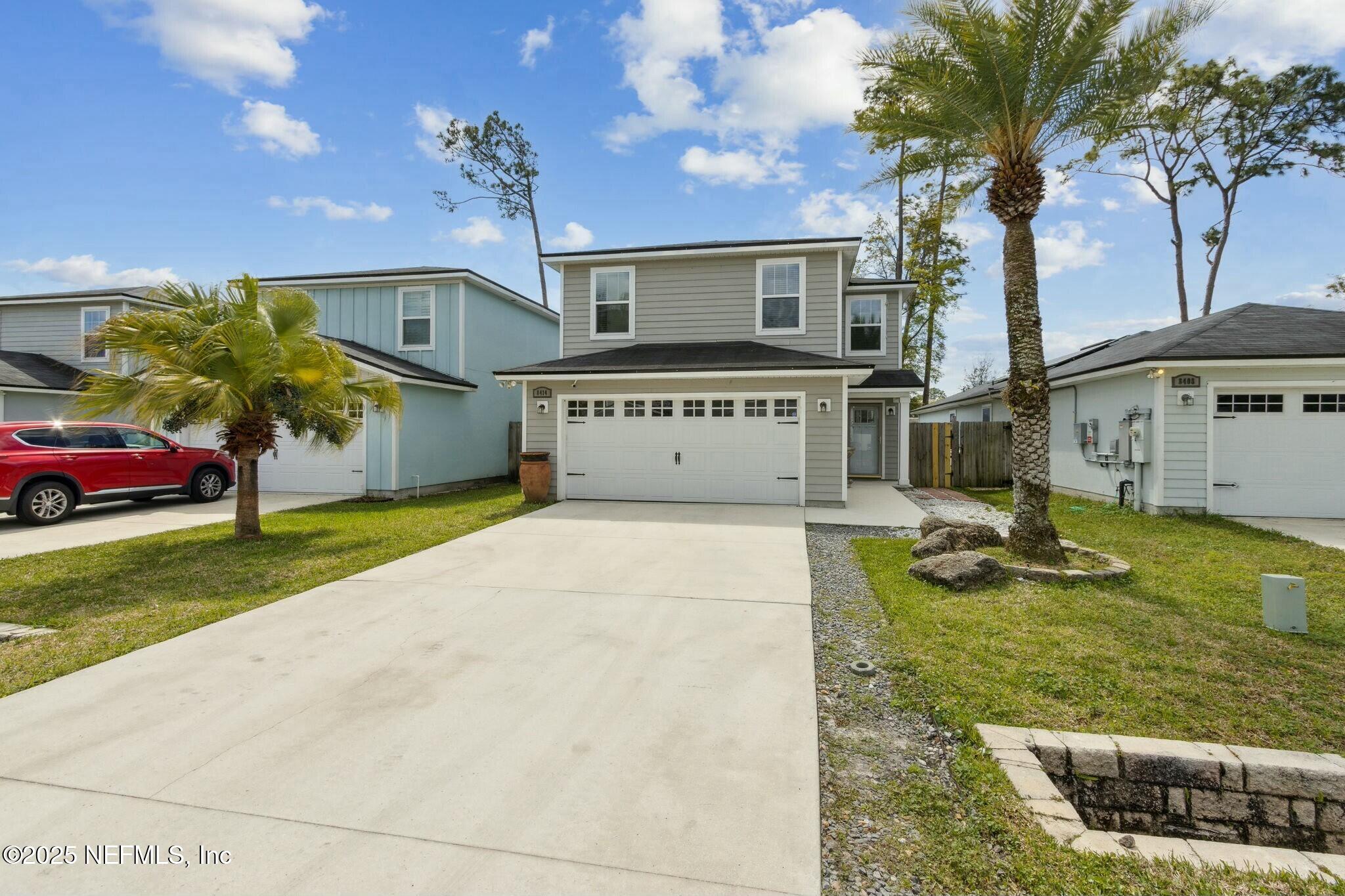 8414 Thor Street Jacksonville, FL 32216 - Photo 4 of 40 a front view of a house with garden