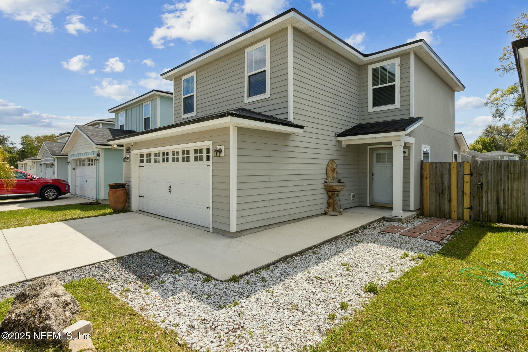8414 Thor Street Jacksonville, FL 32216 - Photo 6 of 40 a front view of a house with a yard