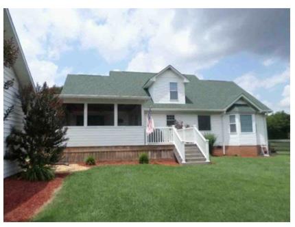 2590 Holloway Road Lebanon, TN 37090 - Photo 3 of 19 a front view of a house with a garden and plants