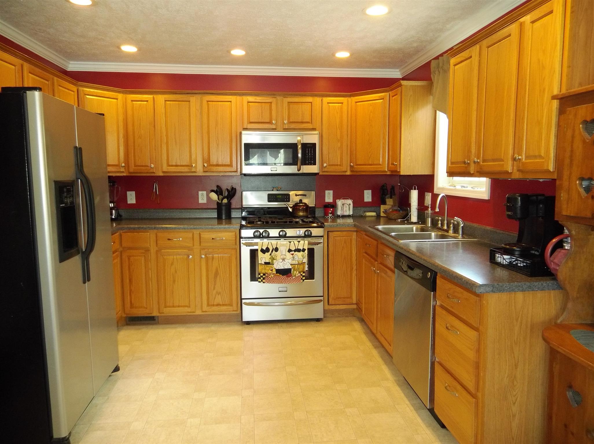 2590 Holloway Road Lebanon, TN 37090 - Photo 10 of 19 a kitchen with stainless steel appliances a stove top oven a refrigerator a sink and a microwave