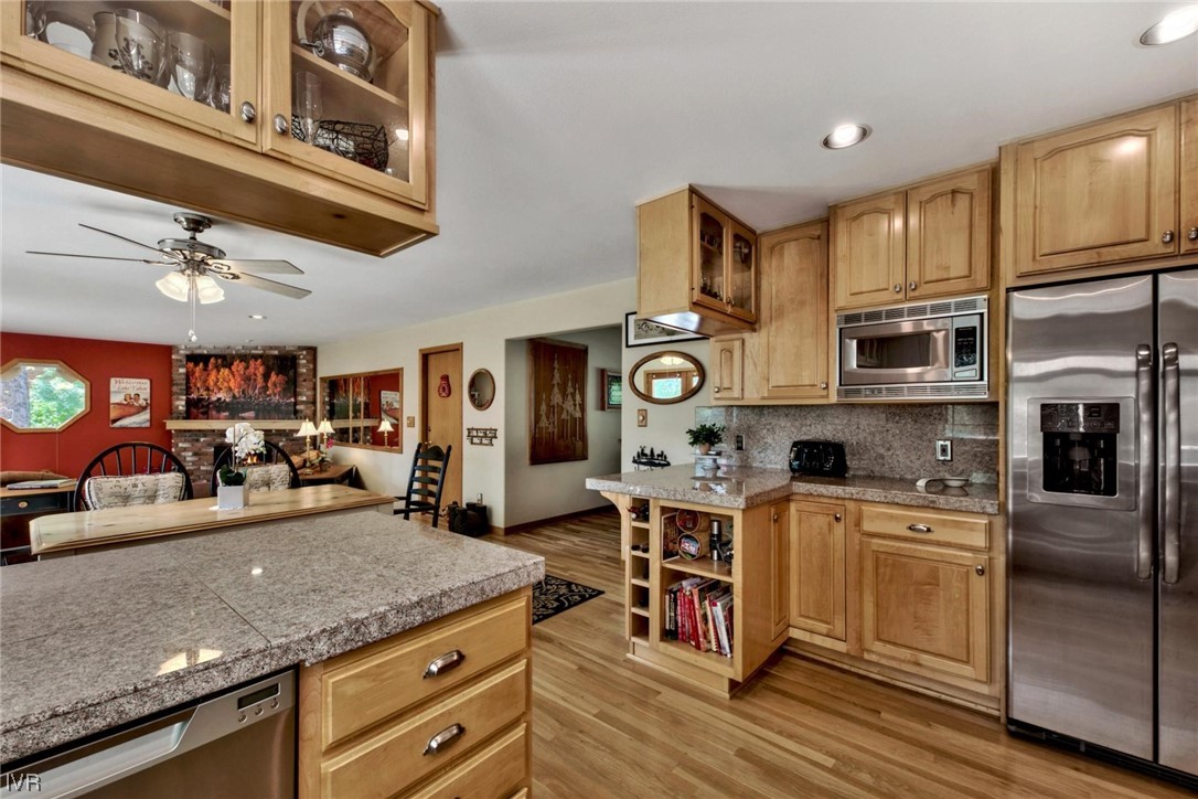 969 Cinnabar Court Incline Village, NV 89451 - Photo 15 of 28 a kitchen with stainless steel appliances granite countertop a stove and cabinets