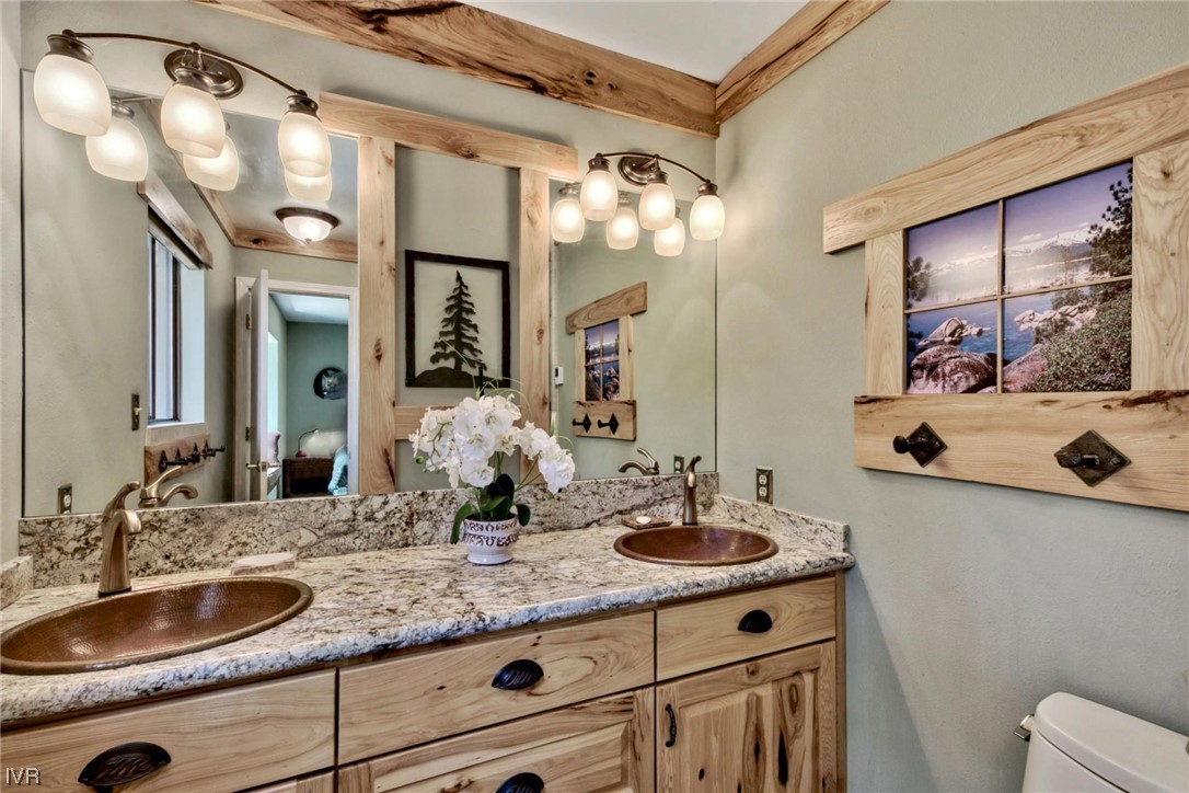 969 Cinnabar Court Incline Village, NV 89451 - Photo 17 of 28 a bathroom with a sink vanity and a mirror