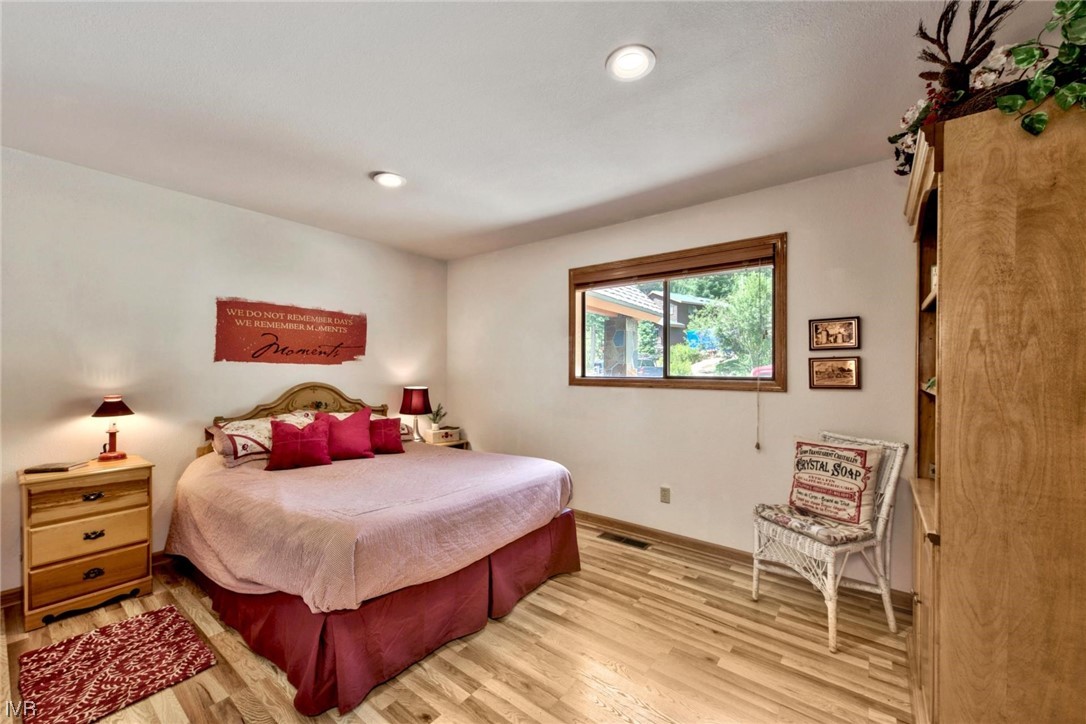 969 Cinnabar Court Incline Village, NV 89451 - Photo 18 of 28 a bedroom with a bed and a dresser
