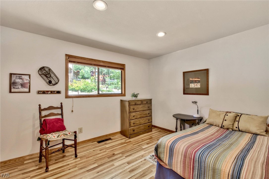 969 Cinnabar Court Incline Village, NV 89451 - Photo 21 of 28 a bedroom with bed and wooden floor