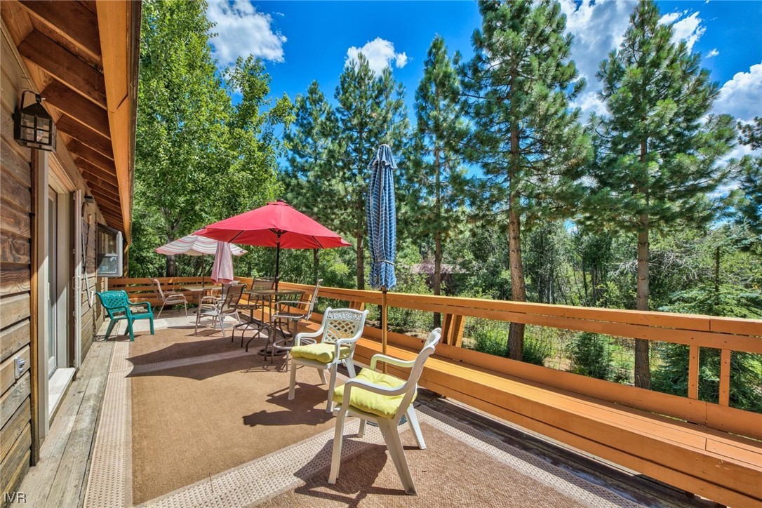 969 Cinnabar Court Incline Village, NV 89451 - Photo 22 of 28 a view of a patio with a table and chairs under an umbrella