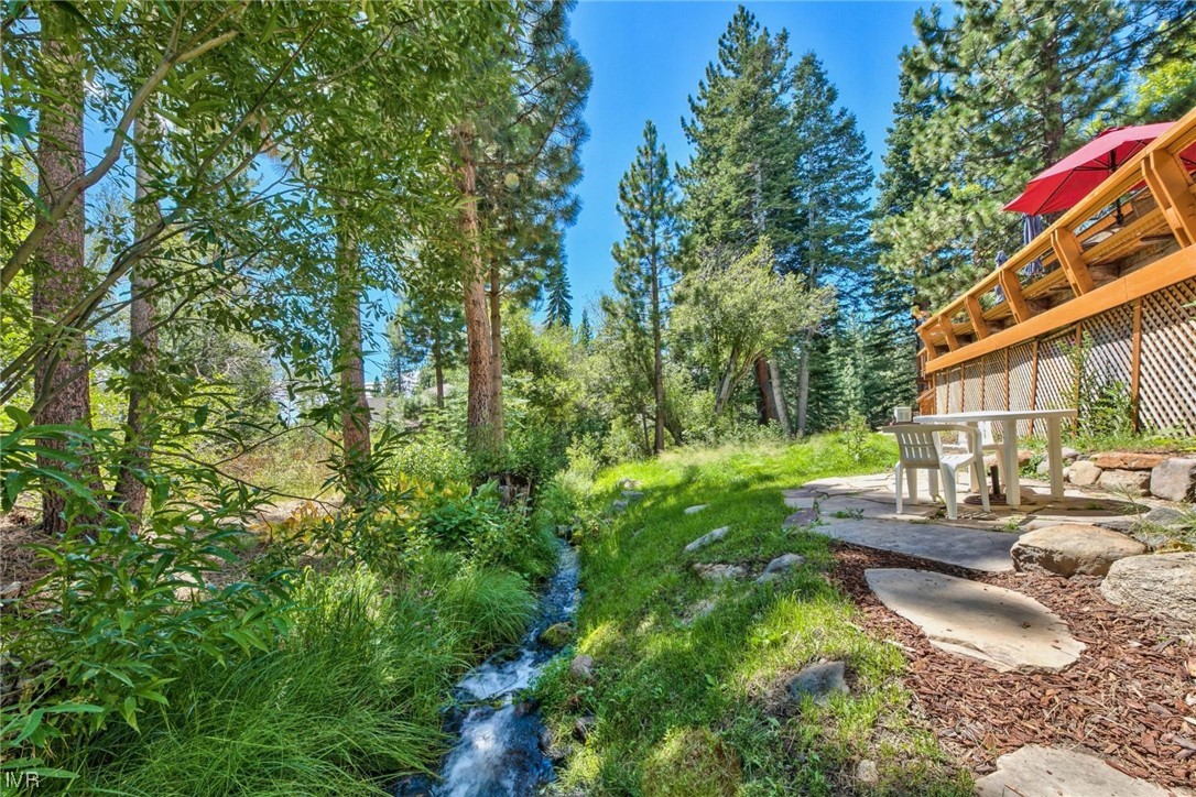 969 Cinnabar Court Incline Village, NV 89451 - Photo 27 of 28 a backyard of a house with outdoor seating and trees