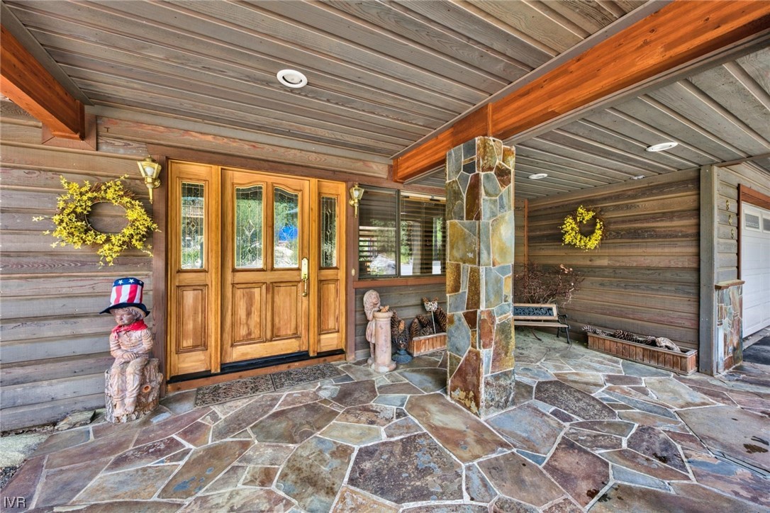969 Cinnabar Court Incline Village, NV 89451 - Photo 7 of 28 a view of a porch with a table and chairs and potted plants