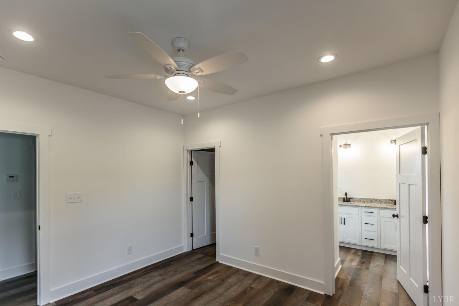 9740 Oakville Road Gladstone, VA 24553 - Photo 37 of 75 an empty room with wooden floor and cabinet