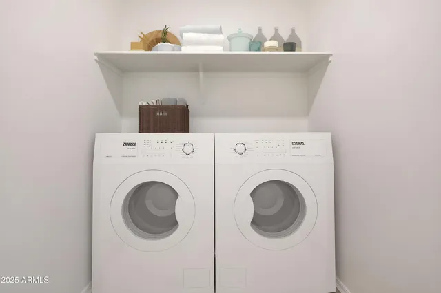 a utility room with dryer and washer