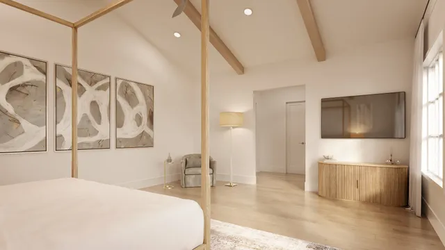 a large white bed in a white room