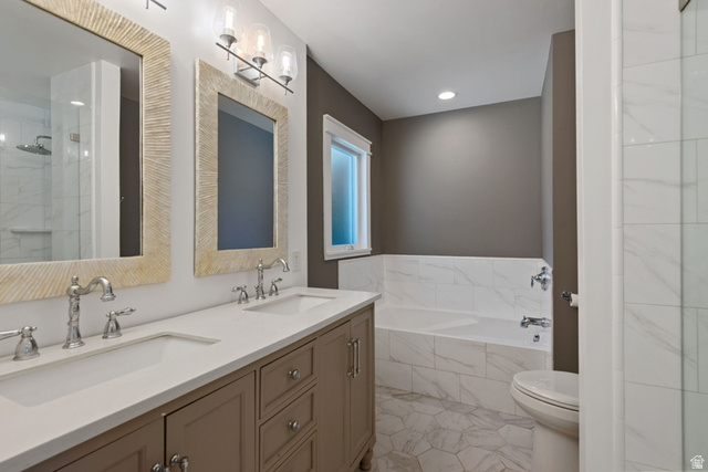 1214 North 300 West Mapleton, UT 84664 - Photo 13 of 33 Primary En-Suite Bathroom featuring a double vanity with stone countertops, a tiled soaking tub, an enclosed glass shower, and tile floors