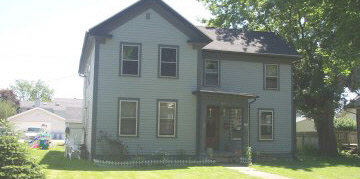 613 North 7th Street Rochelle, IL 61068 - Photo 1 of 1 a front view of a house with garden