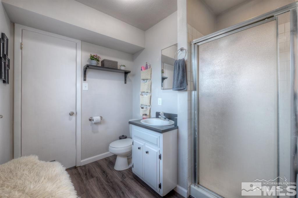 3245 Everett Drive Reno, NV 89503 - Photo 16 of 19 a bathroom with a granite countertop sink toilet and shower