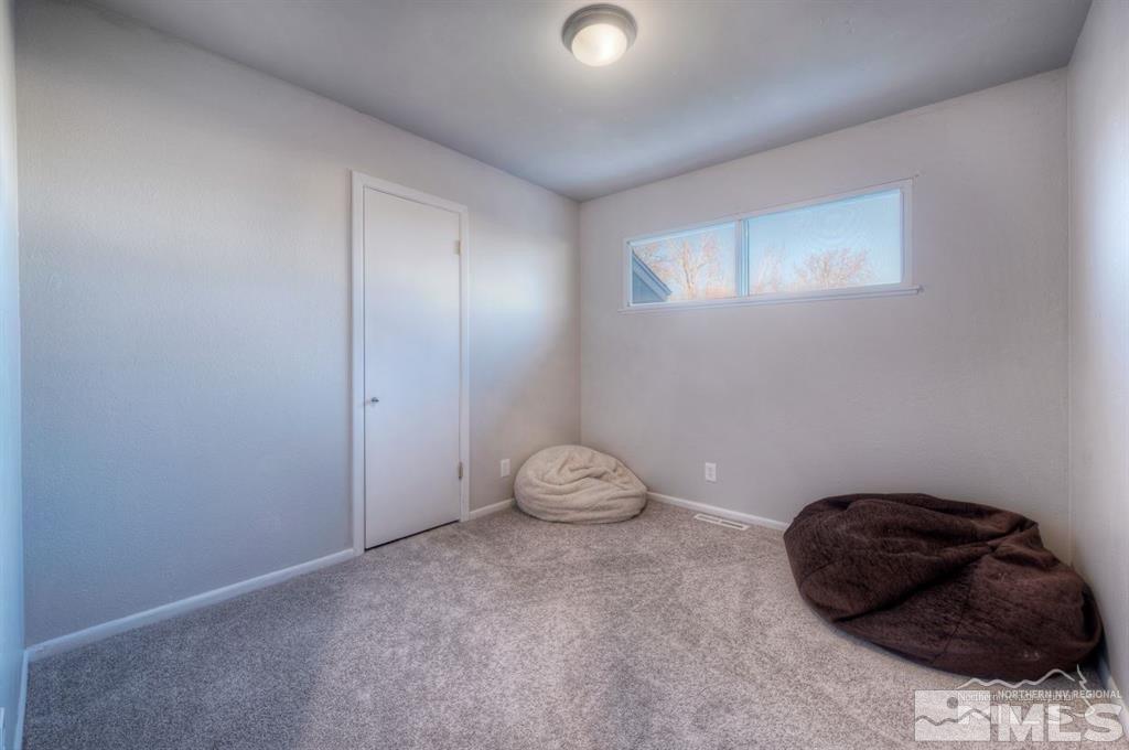 3245 Everett Drive Reno, NV 89503 - Photo 18 of 19 a room with a cabinets and a chair