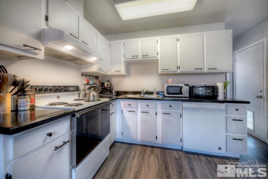 3245 Everett Drive Reno, NV 89503 - Photo 4 of 19 a kitchen with stainless steel appliances granite countertop a sink and cabinets
