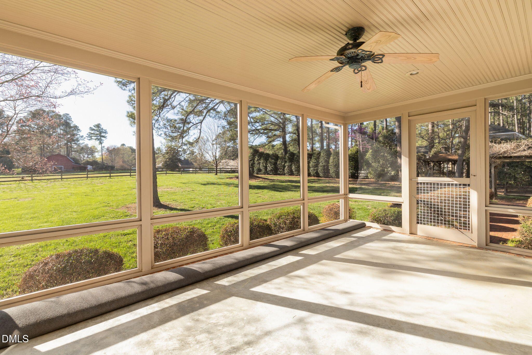 4076 Salem Farm Road Oxford, NC 27565 - Photo 39 of 55 a view of a balcony with a floor to ceiling window and an outdoor view
