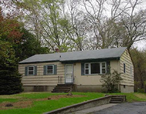 385 Stevenson Road Fairfield, CT 06825 - Photo 1 of 1 a front view of a house with a yard