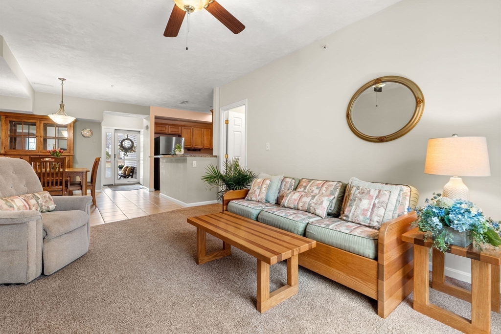237 Salem Street, Unit 2 Reading, MA 01867 - Photo 14 of 34 a living room with furniture fireplace and a mirror