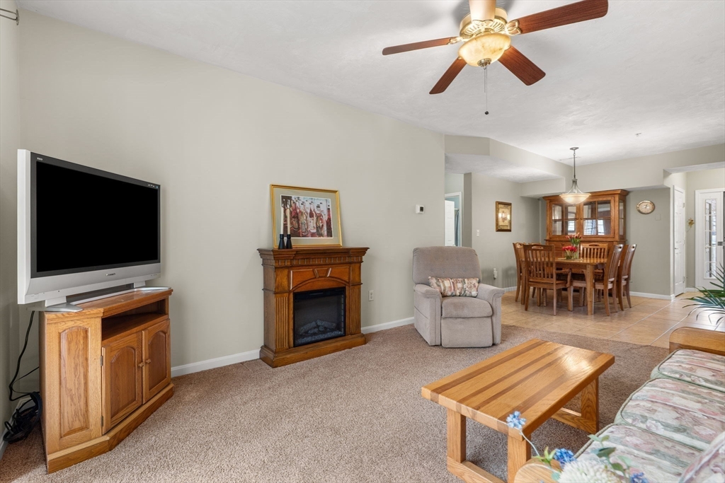 237 Salem Street, Unit 2 Reading, MA 01867 - Photo 15 of 34 a living room with furniture and a flat screen tv