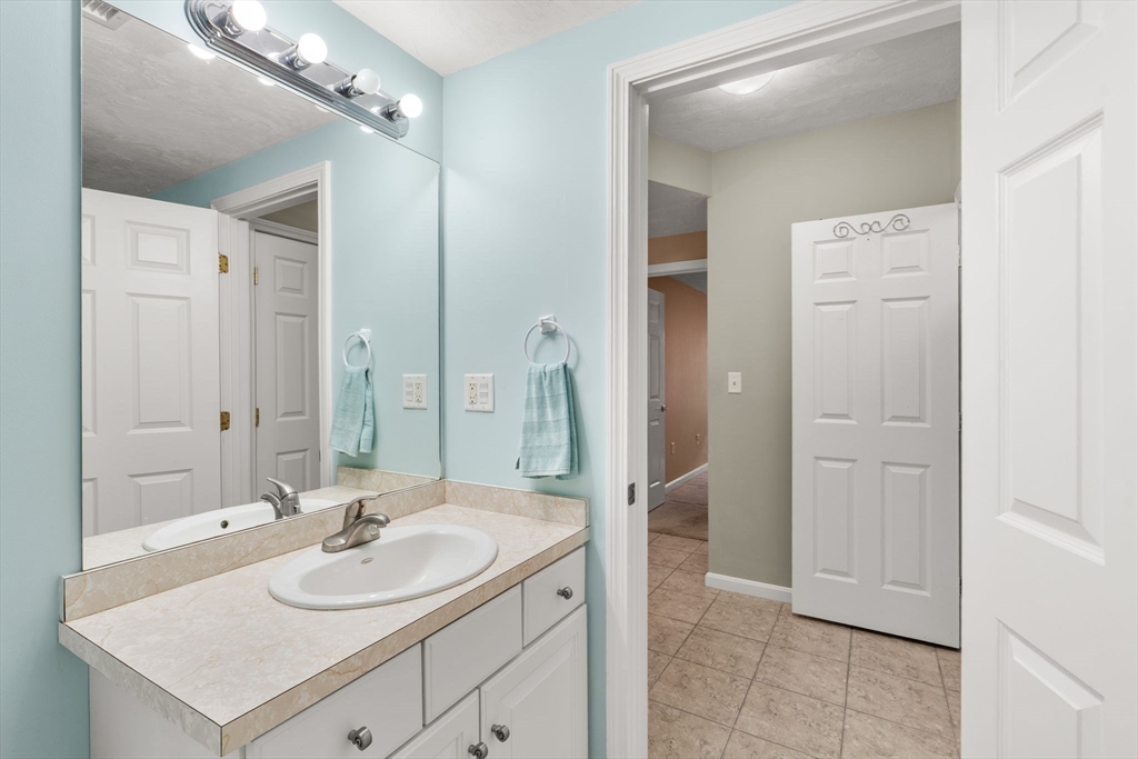 237 Salem Street, Unit 2 Reading, MA 01867 - Photo 26 of 34 a bathroom with a sink double vanity and a mirror
