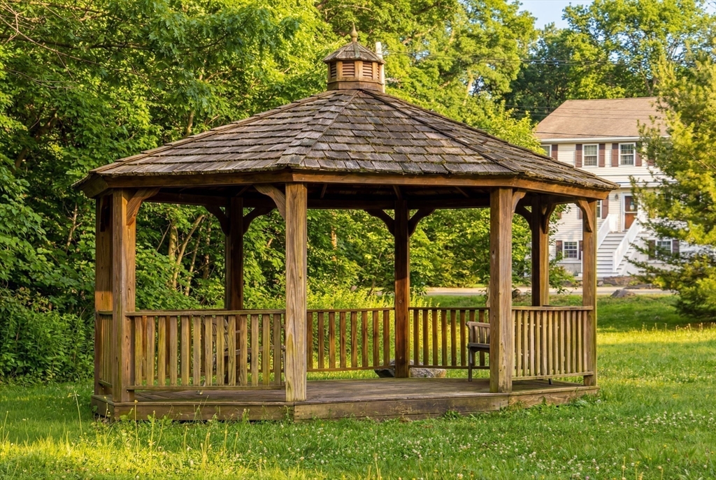 237 Salem Street, Unit 2 Reading, MA 01867 - Photo 30 of 34 a view of a wooden house with a large window and yard