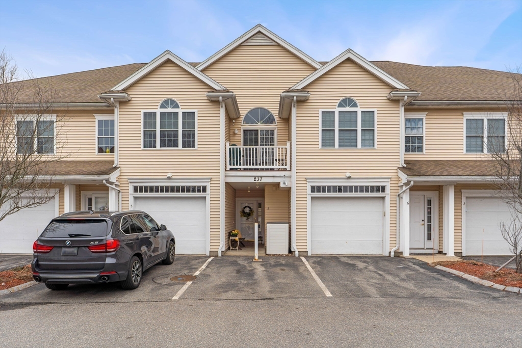 237 Salem Street, Unit 2 Reading, MA 01867 - Photo 33 of 34 a view of a car parked in front of a house