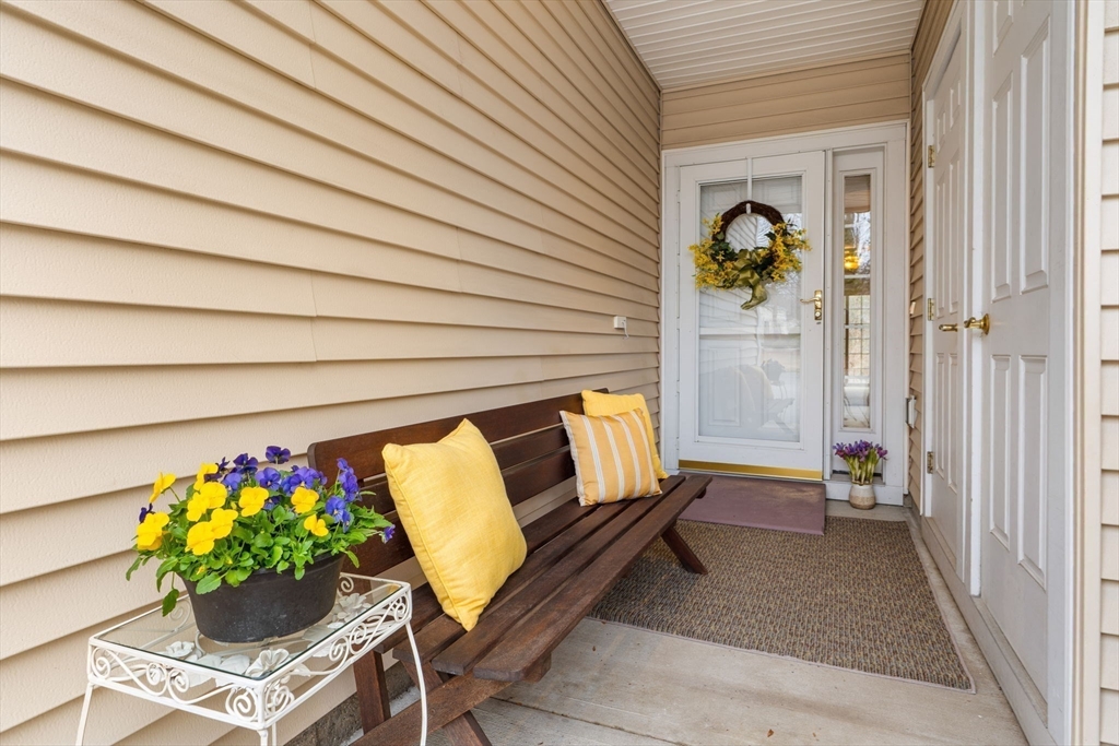237 Salem Street, Unit 2 Reading, MA 01867 - Photo 4 of 34 a outdoor living space with a couch and flowers