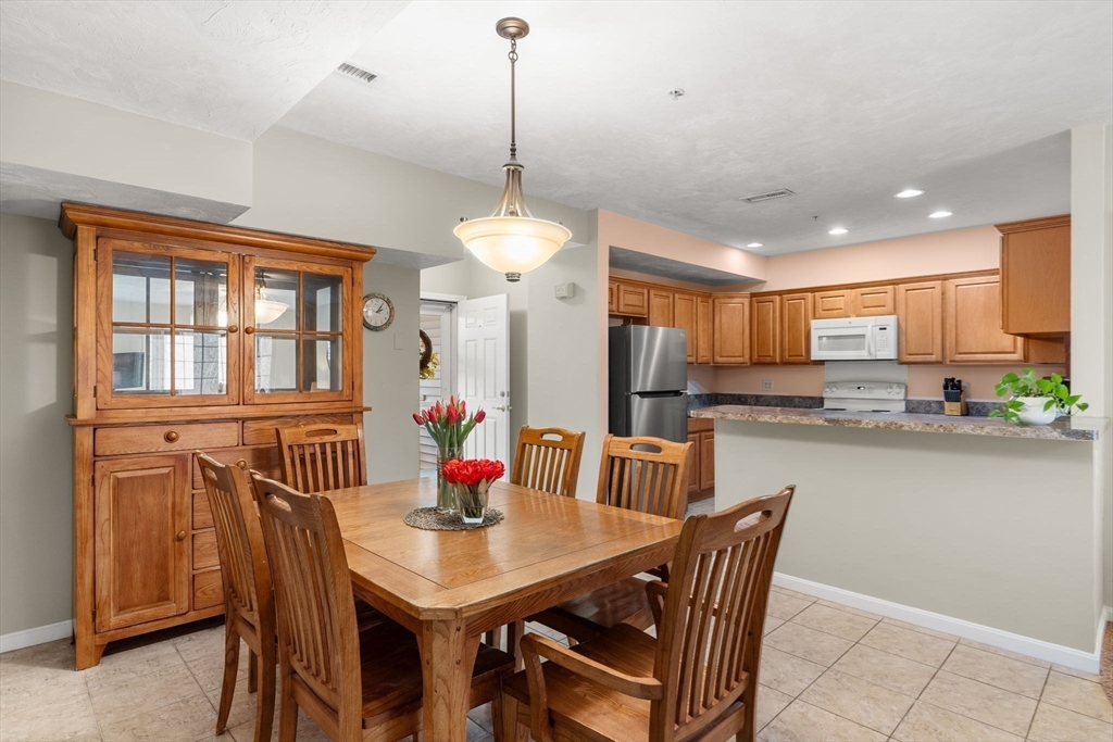 237 Salem Street, Unit 2 Reading, MA 01867 - Photo 10 of 34 a view of a dining room with furniture