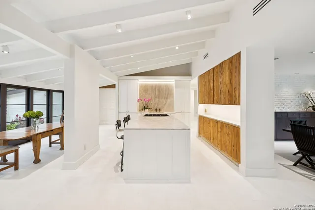 a view of living room filled with furniture and window