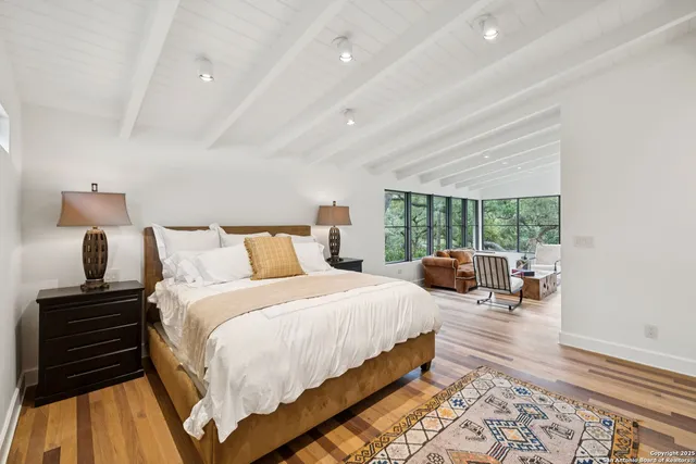 a bedroom with bed and window