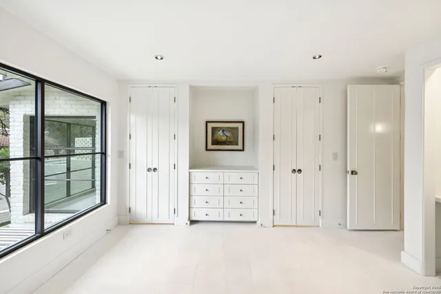 a bathroom with a granite countertop sink mirror and double