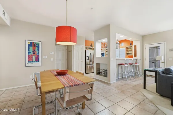 a living room with furniture a rug and a chandelier