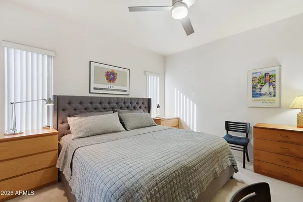 a bedroom with a bed and a dresser