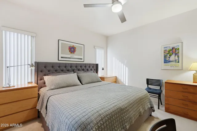 a bedroom with a bed and a dresser