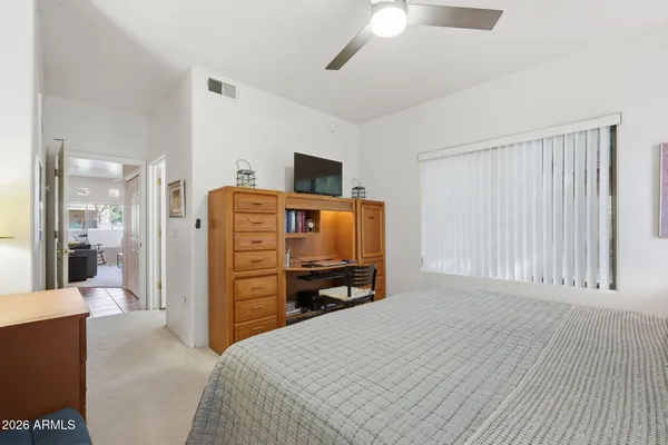 a bedroom with a bed and furniture