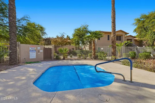 a swimming pool with outdoor seating and yard