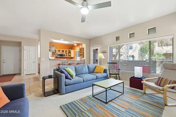 a living room with furniture and a large window