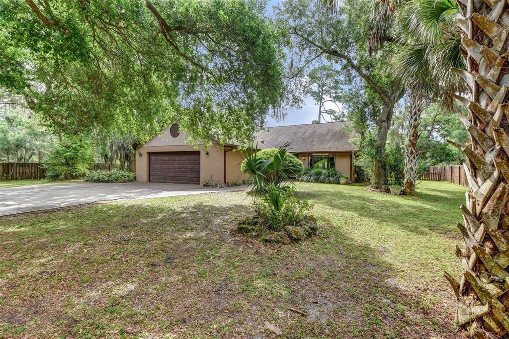 Over an acre of Flagler Beach privacy with this 4/3 pool home.