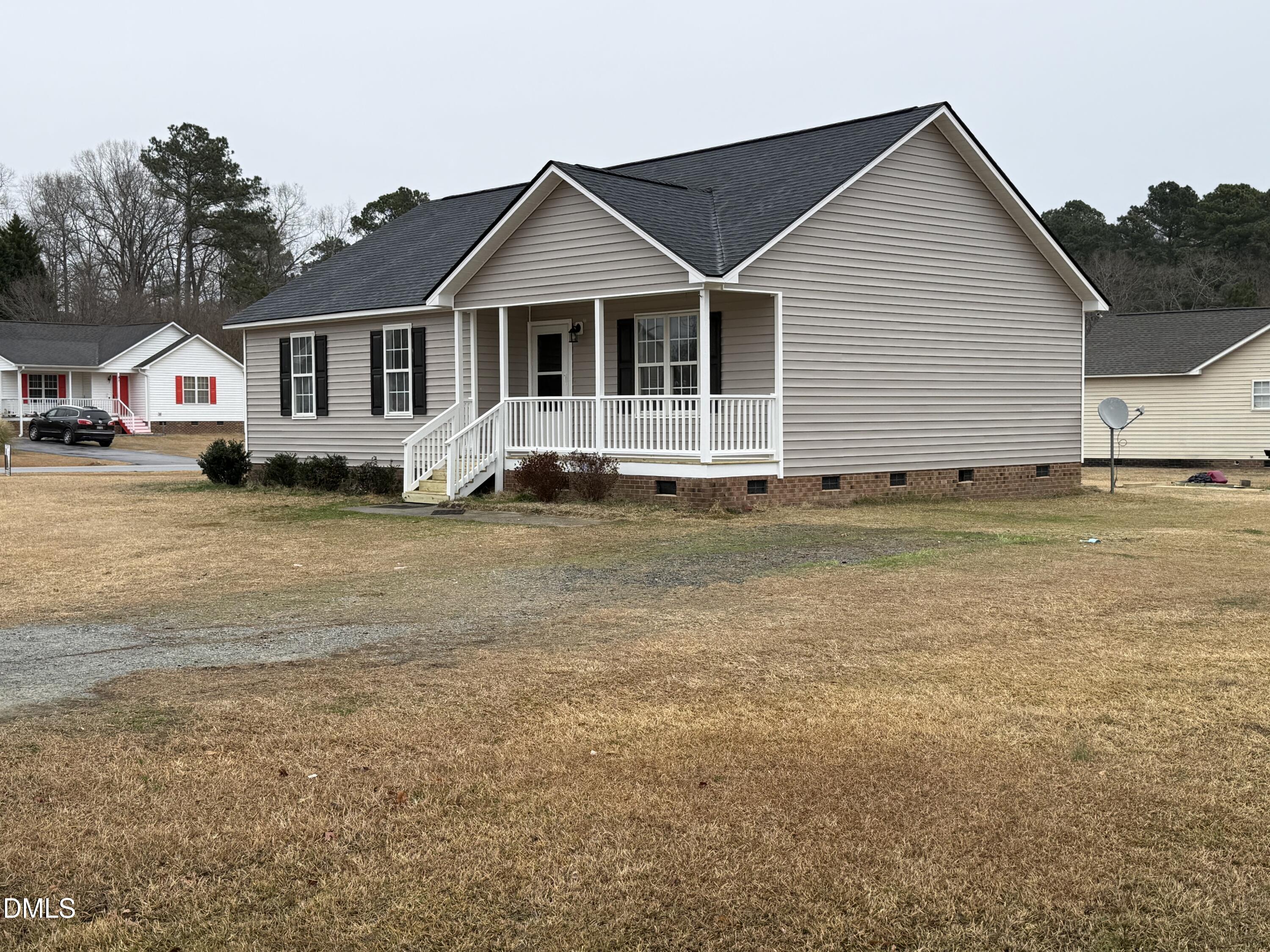 101 Copper Stone Street Smithfield, NC 27577 - Photo 11 of 32 a view of a house with a yard