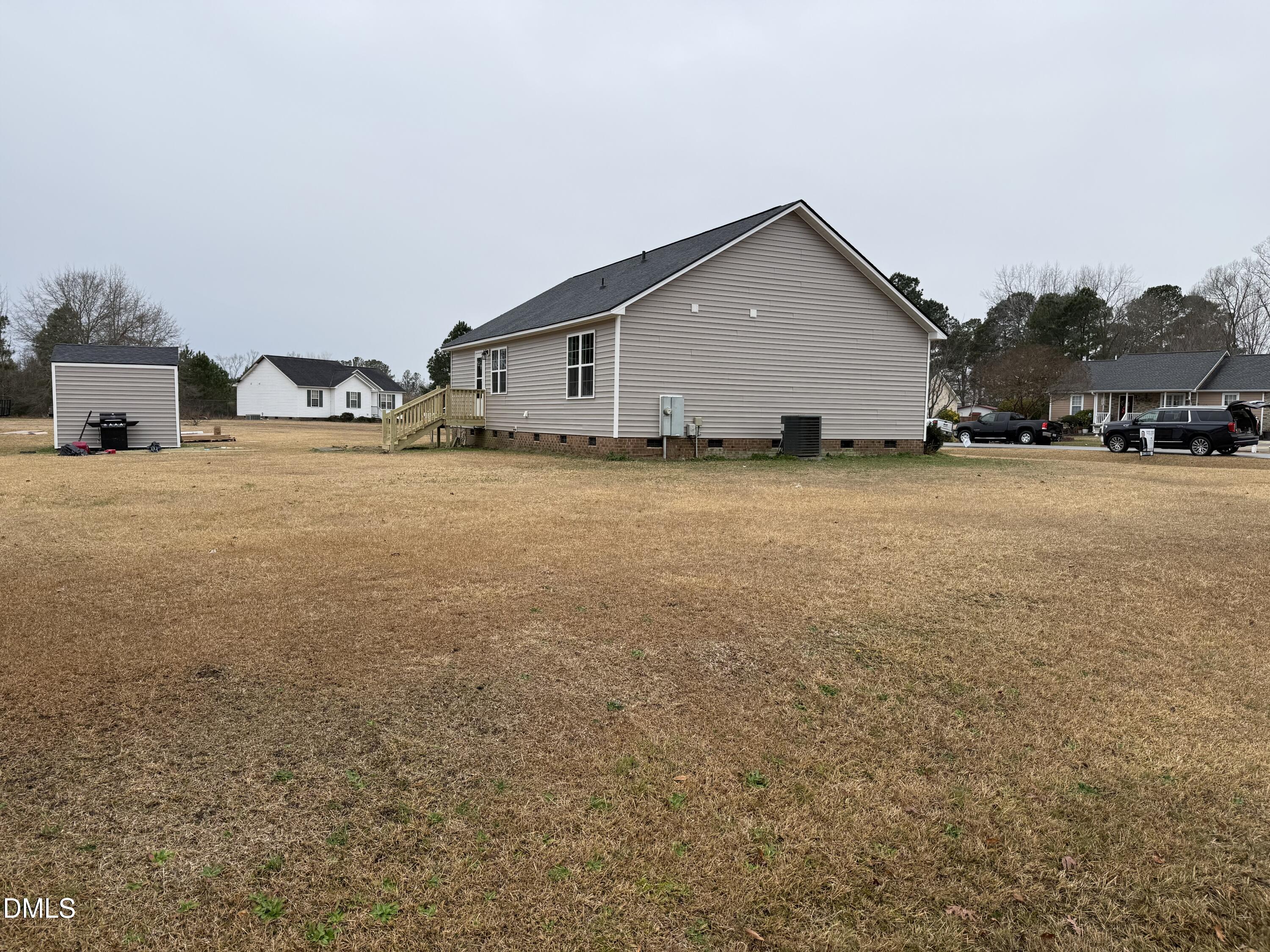101 Copper Stone Street Smithfield, NC 27577 - Photo 14 of 32 a front view of house with yard and trees