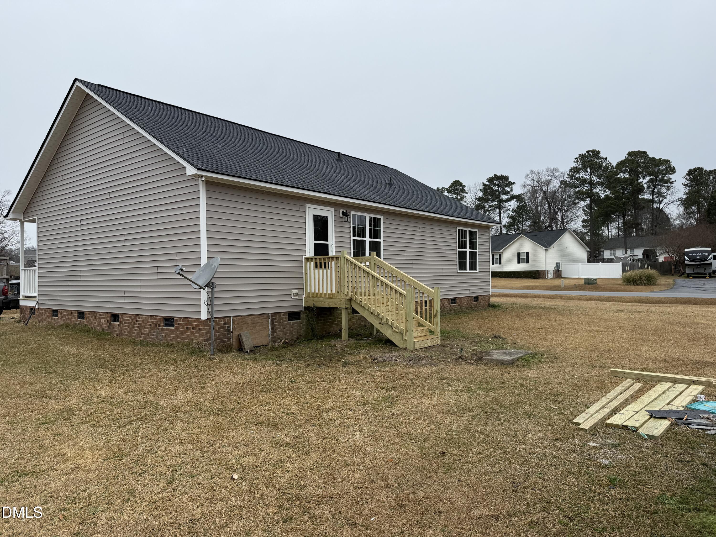 101 Copper Stone Street Smithfield, NC 27577 - Photo 15 of 32 a view of a house with a yard
