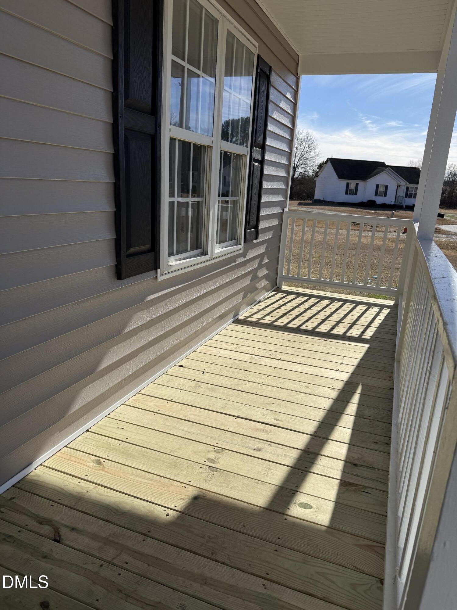 101 Copper Stone Street Smithfield, NC 27577 - Photo 16 of 32 a view of a balcony with wooden floor