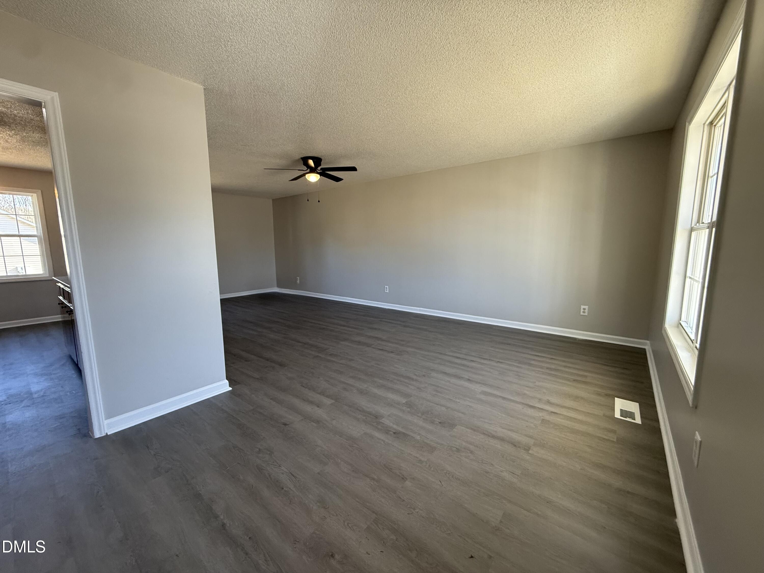 101 Copper Stone Street Smithfield, NC 27577 - Photo 17 of 32 an empty room with wooden floor