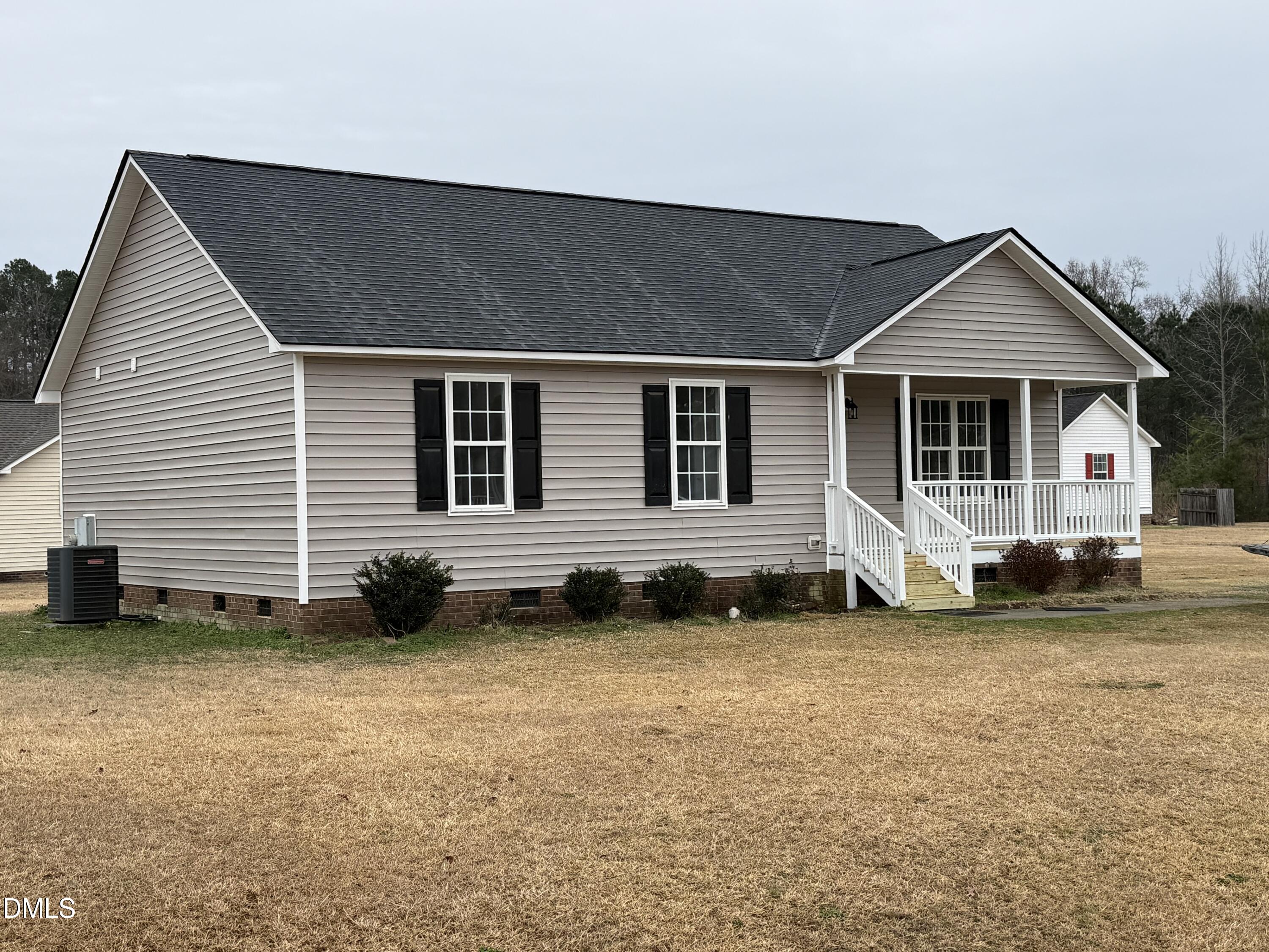 101 Copper Stone Street Smithfield, NC 27577 - Photo 2 of 32 a house view with a outdoor space