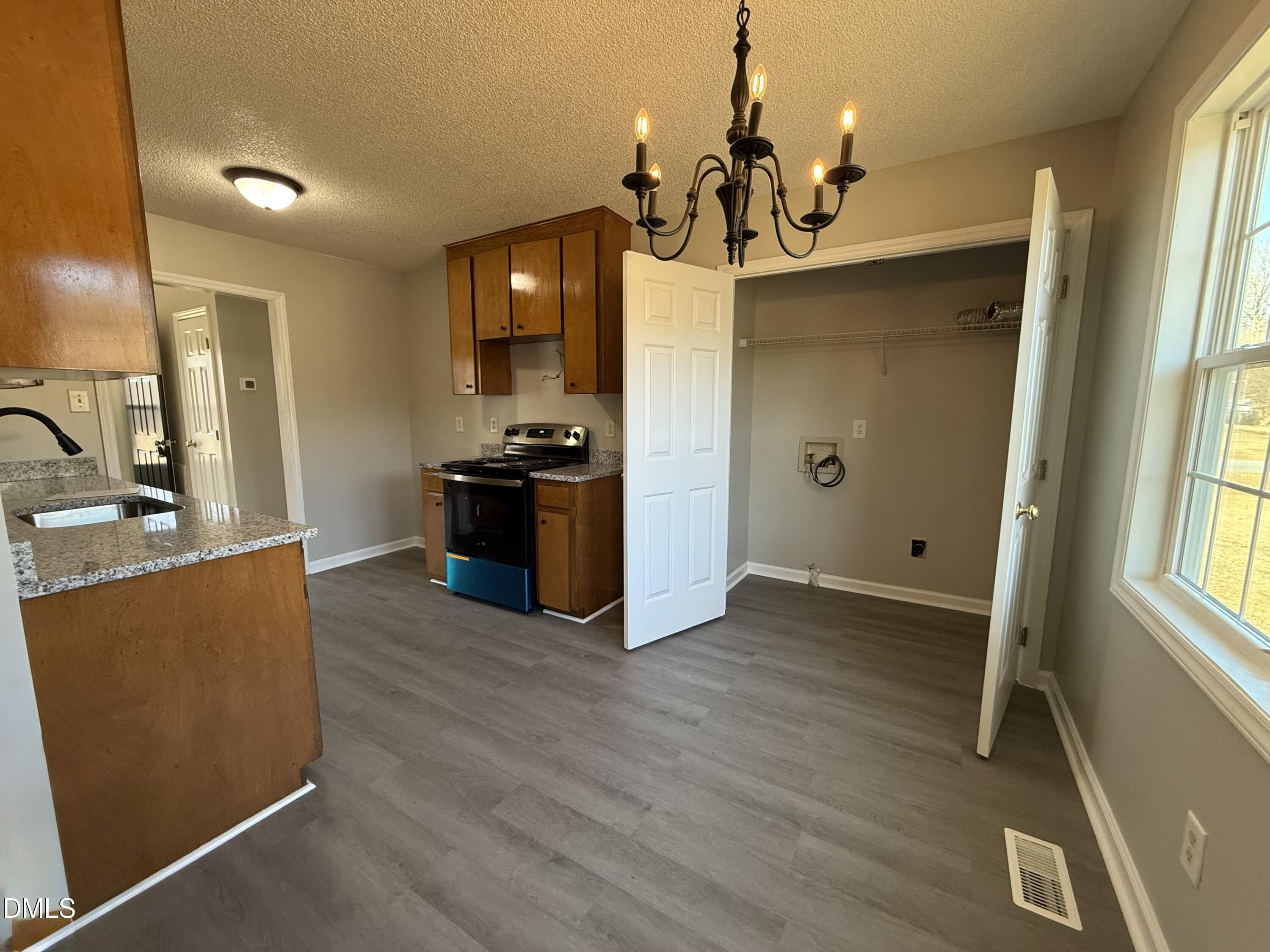 101 Copper Stone Street Smithfield, NC 27577 - Photo 22 of 32 a view of a kitchen cabinets and wooden floor